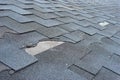 ÃÂ¡lose up view of asphalt shingles roof damage that needs repair. Royalty Free Stock Photo